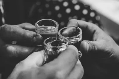 people cheers'ing with moonshine