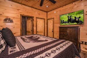 bedroom inside of Gatlinburg cabin with bear decorations