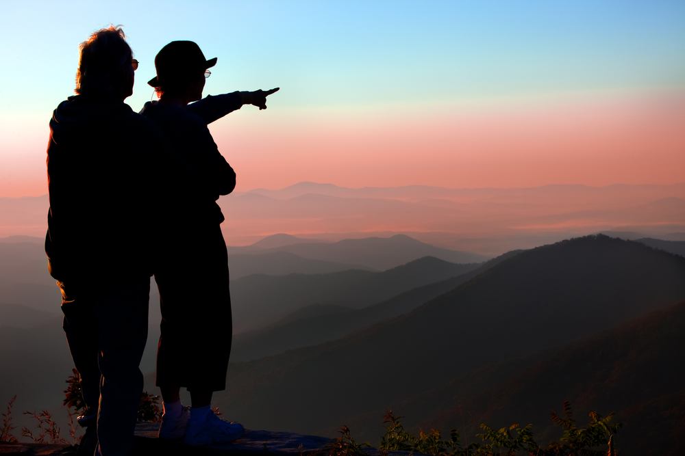 couple watching sunrise in smoky mountains