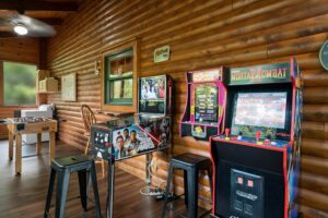 A room with arcade games including Pinball