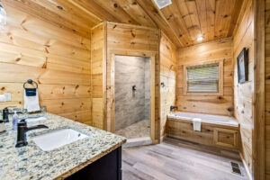 Large en-suite bathroom with separate shower and jetted tub