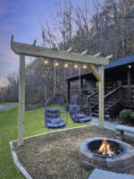 Egg shaped hanging chair around fire pit awaits you