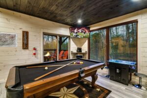 Game room has a pool table, 55 TV, and arcade games!